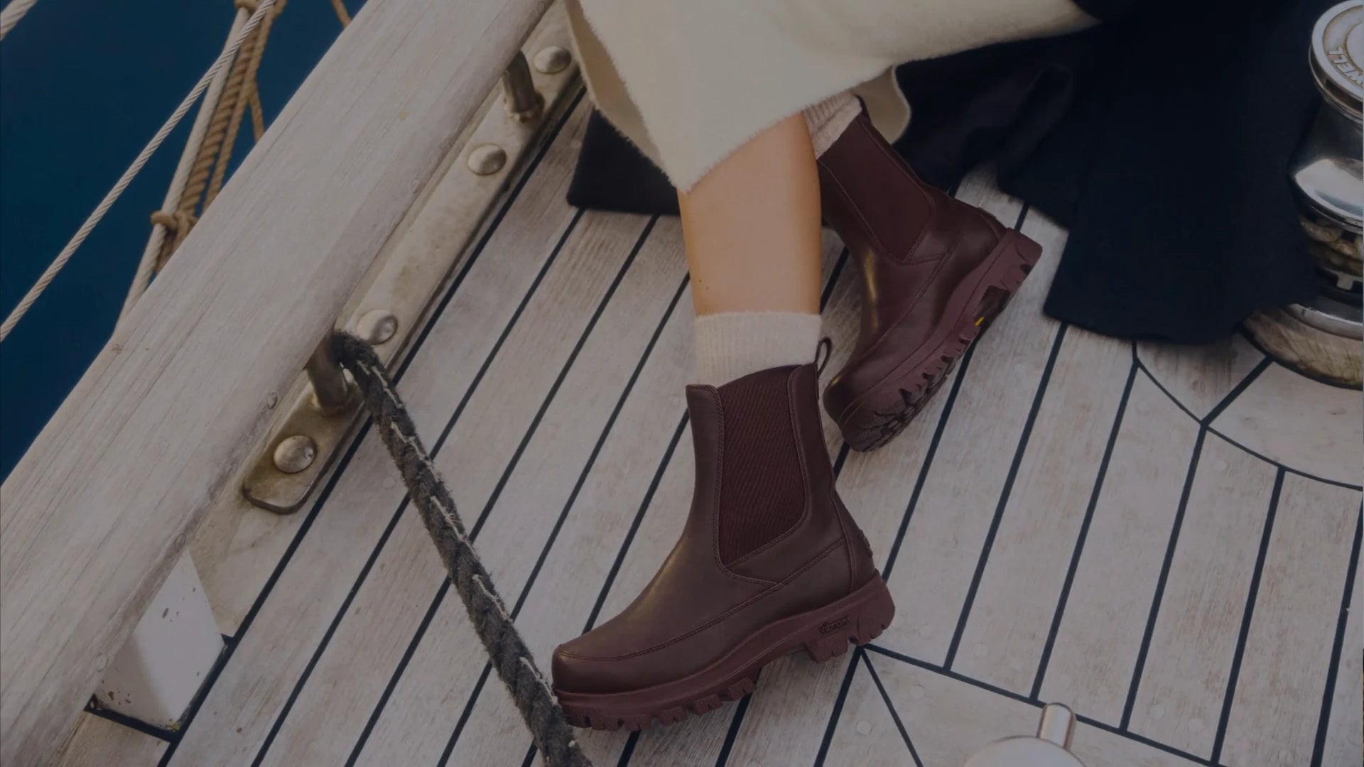 Seasonal SOREL boots on a boat deck